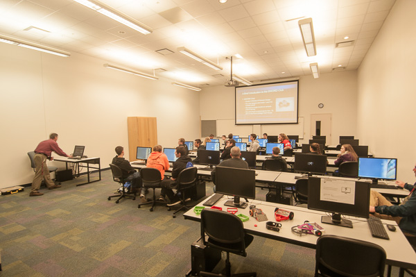 Instructor Craig A. Miller (left) previews the exciting world of engineering design technology ...