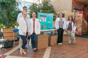 Students in a Community Health Nursing course at Pennsylvania College of Technology provide hygiene education to their peers while conducting a collection of personal items for The Cupboard, an on-campus food pantry for students in need. (Photo by J.J. Boettcher, student photographer)