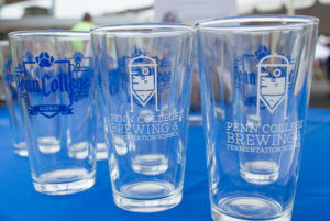 The artwork adorns glassware, stylishly promoting the two-year brewing and fermentation degree.