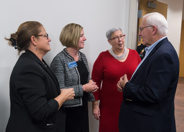 Sen. Yaw talks with (from left) Suzanne T. Stopper, vice president for finance/chief financial officer; Carolyn R. Strickland, vice president for enrollment management/associate provost; and President Gilmour.
