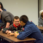 With the event organizer visible at left background, aviation students Kerry K. Loeb (left), of Glen Mills, and Samuel J. Pham, of Camp Hill – another of the Penn College's CPEs – turn a discussion prompt into meaningful interaction.