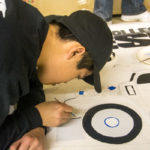 A member of the Penn College Diesel Club details the group's "Coal for Christmas" entry.