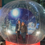 Williamsport cousins Rebecca L. Helminiak (left), an occupational therapy assistant student, and Jane C. Mertes, an applied management major, pose inside an oversized, inflatable snow globe ...