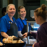 Dining Services workers Sara B. Bernier (left) and Alanna J. Winner add their trademark smiles to customer service.