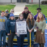 Joining a group photo on behalf of Penn College Benefiting THON are Butler (holding sledgehammer) and counselor Jacklyn R. Leitzel, club adviser (second from right).