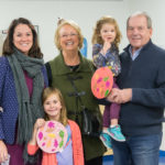 Three generations celebrate the season at a decidedly family-friendly event. "Mimi" Janice and "Pappy" Robert Murphy, visiting from Pittsburgh, join their granddaughters, Macy (foreground) and Maura, and daughter-in-law Ashley R. Murphy, director of admissions.