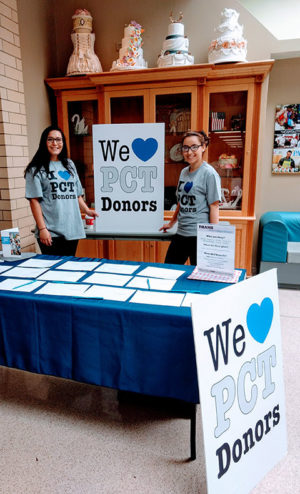 Baking and pastry arts majors Sarah A. Waclo (left), of York, and Olivia M. Lunger, of Elysburg (also a student development assistant) staff a table ...