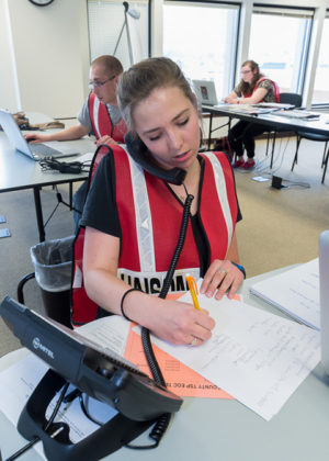 Elizabeth L. Landis, of Columbia, addresses logistics during a simulated tornado disaster, one of many community-based training exercises that are part of the emergency management technology curriculum at Penn College.