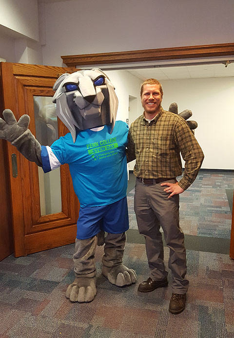 Alumnus Derek F. Knipe, a manufacturing engineer at PMF Industries in Williamsport, gets a Wildcat welcome back to campus.