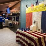 A "thank you" wall provides a forum for gratitude, and a staff-knitted blanket is among the door prizes on display.