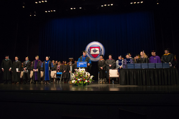With the platform party in place, Paul L. Starkey, vice president for academic affairs/provost, welcomes grads and guests.