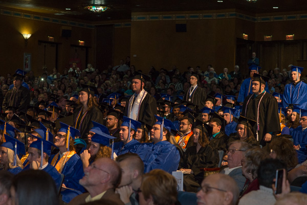 Veterans stand to be acknowledged by an appreciative crowd.