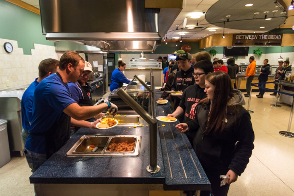 Dining Services feeds pancakes, eggs, home fries, bacon and other satisfying fare to a seemingly endless line of hungry patrons.
