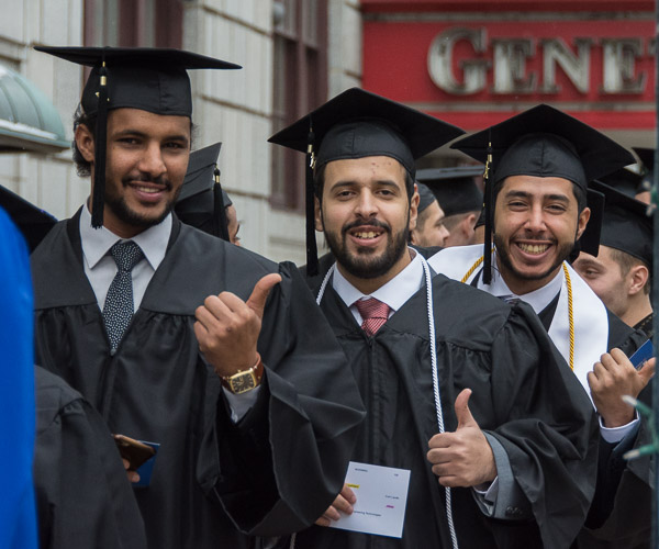 Soon-to-graduate plastics students give the camera “thumbs-up.”