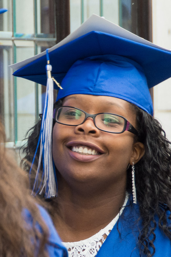A new alum's sunny smile hints at her post-graduation potential.