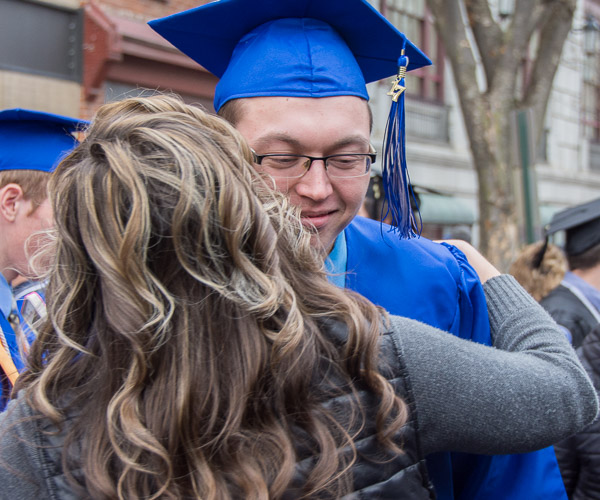 Jacob M. Snyder, a graduate of heavy construction equipment technology: operator emphasis, accepts a hug from his mother, Bridgette, secretary to the directors of the paramedic and physical therapist assistant programs.