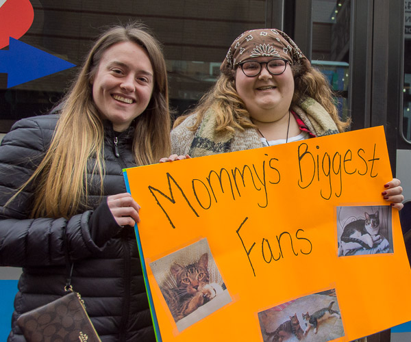 Charlie A. Geisel and Morgan M. Reibsome, who graduated from the health information technology major in May, made signs to catch the attention of their friend Elizabeth M. DiMaio, who graduated from the same major on Saturday. The one they’re holding features DiMaio’s pets.