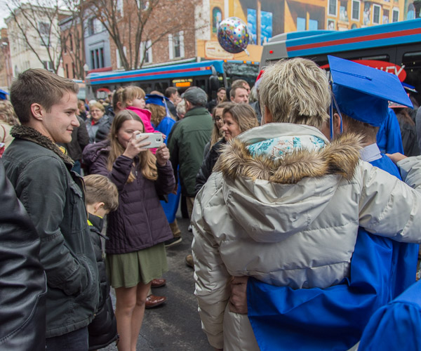 A family finds space for photos among the crowd.