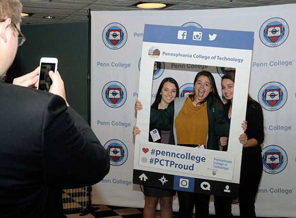 Hughesville High School classmates have some pre-convention fun with a photo frame.