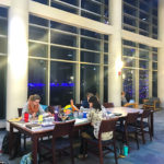 With holiday lights twinkling in the background, students settle in at Madigan Library – fortified with snacks and other long-haul survival provisions.