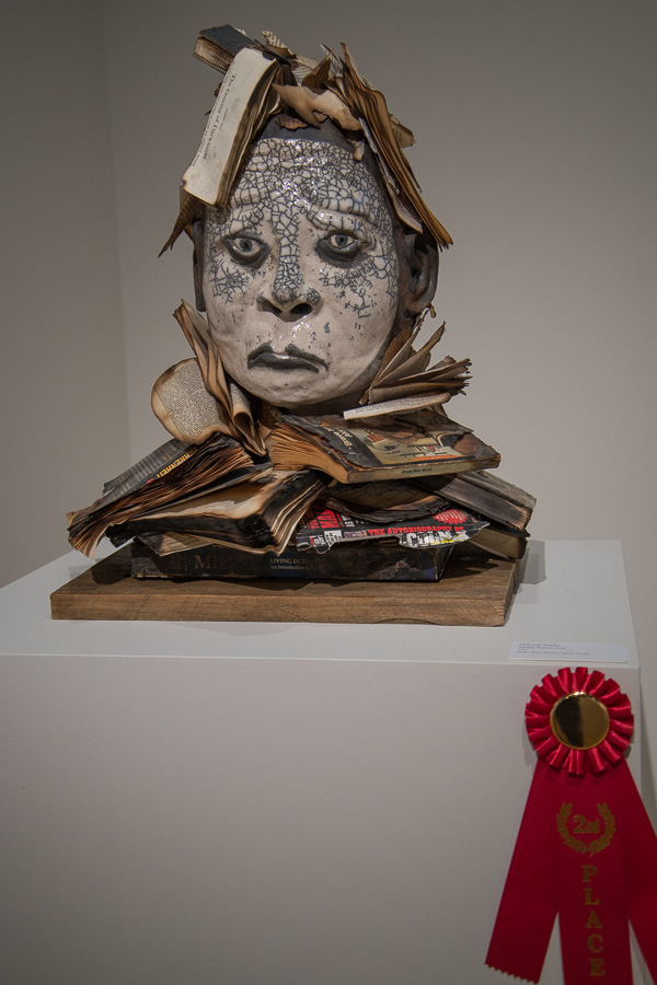 “History Repeats Itself” expresses Deborah Stabley’s concerns about our tumultuous times. Capturing the second-place ribbon, the Penn College art faculty member's work employs Raku-fired ceramics and burned books.