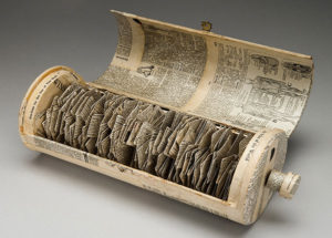 Adele Crawford's “Spinning Lexicon,” dictionary, dowel, found box, 12 inches by 5 inches