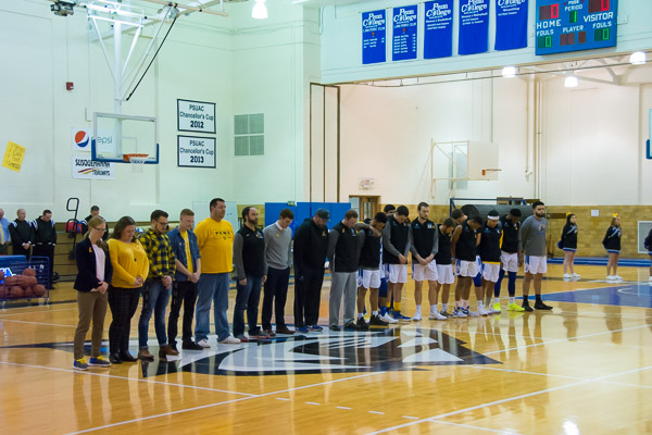 A midcourt gathering honors lost lives while espousing hope and well-being.
