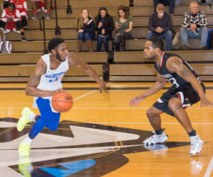 Jesse White (14) scored 10 points in the Wildcats' losing effort against Bryn Athyn College on Saturday.