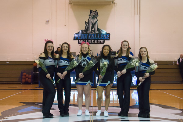Members of the Wildcat Dance Team bloom at midcourt.
