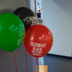 Commemorative balloons accent the festivities.