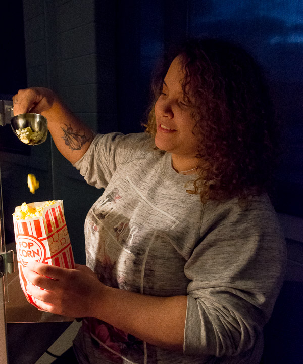 WEB's Natascha G. Santaella serves up popcorn at movietime.