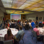 Mackey introduces the keynoter to a PDC full house, including honorees and their guests, nominators and AWE alumnae.