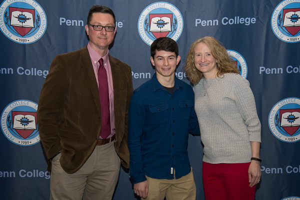 Eton M. Spancake (center), recipient of the Richard & Mildred Taylor Memorial Scholarship, is joined by his scholarship supporters, Walter and Erin Shultz, college employees.