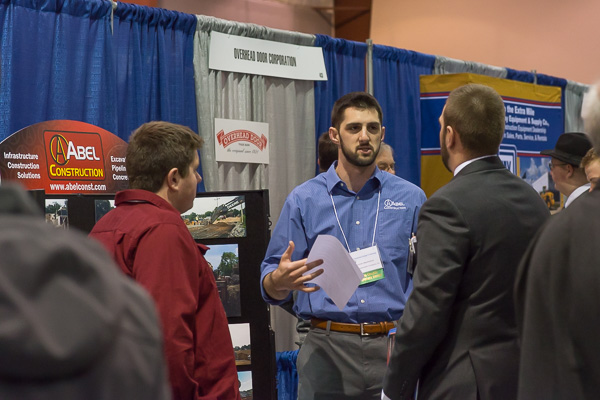Alumnus Corvin K. Oberholtzer “holds court” in the Field House, talking to candidates about Abel Construction Co. Inc. Oberholtzer (’10 and ’12) earned associate degrees in building construction technology and building construction: masonry emphasis, as well as a bachelor’s degree in residential construction technology and management. 