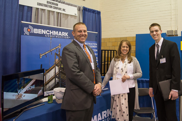 “Well Done” words (at left) complement this trio’s goodwill. From left are Christopher Smith and Lynda Sherwood, of Benchmark Construction Co. Inc., and Brendan B. Thompson, a construction management student from Womelsdorf. <br />
<br />
