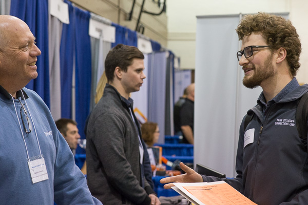 Nathaniel H. Lyon (right), a welding and fabrication engineering technology student from Fredericksburg, makes a connection with Richard J. Gerhard, of Siemens Industry Inc. 