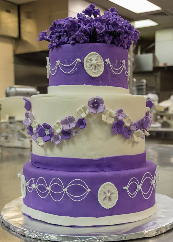 To achieve some of her stringwork arches, Maria E. Berrios, of Bethlehem, turned her cake upside down.