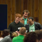 Surrounded by impish improvisers, Christopher D. Hogan, a welding and fabrication engineering technology major from Halifax, reads the dearly departed's final address to his heirs.