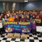 After the seeds are packed and boxed for shipment from GAiN's warehouse in Mount Joy, student volunteers mark their accomplishment with a photo.