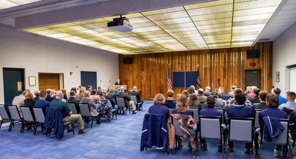Family, friends and college mentors gather in the PDC for Tuesday's ceremony.