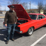 Loren R. Bruckhart, collision repair instructor and department head, with his Dodge Charger