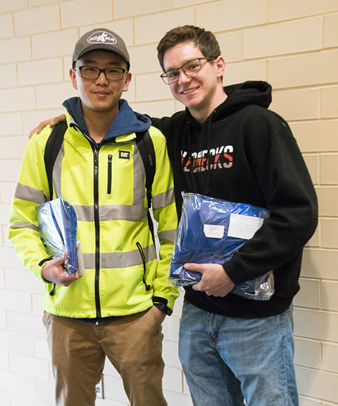 Po-Ju Sung, of Taiwan, and Jonathon M. Conway, of Durham, Conn., are one step closer to walking across the Community Arts Center stage. Sung, graduating in heavy construction equipment technology: Caterpillar emphasis, and Conway, enrolled in diesel technology, were among those buying their caps and gowns Tuesday morning.