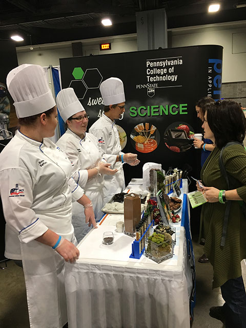 Penn College students (from left) Somer A. Safford, Magdalen C. Bennett and Jacob W. Parobek share culinary-related STEM concepts.