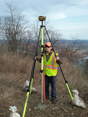 Glenn C. Johnson, a first-year surveying technology major from Sweet Valley, sets up a GPS receiver on an NGS benchmark along Route 15 south of Williamsport. (Photo provided)