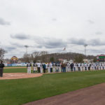Teams and umpires honor America – and its servicemen and women – during "The Star-Spangled Banner."