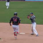 Second baseman Deric S. Ellerman, a residential construction technology and management major from Landisville, turns the double play.