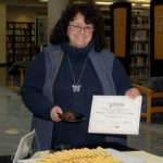Joann L. Eichenlaub, the library's assistant director and leading force in the college's PA Forward ascendancy, displays the certificate of achievement.