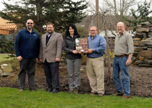 Partners in Penn College's ongoing status as a national Tree Campus mark the designation outside the Schneebeli Earth Science Center, home to the institution's landscape/horticulture technology and forest technology majors. From left are Don J. Luke, director of facilities operations; Justin W. Beishline, assistant dean of transportation and natural resources technologies; Andrea L. Mull, horticulturist/grounds and motorpool supervisor; Carl J. Bower Jr., assistant professor of horticulture; and Andrew Bartholomay, assistant professor of forestry.