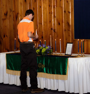 Trevor M. Clouser recites the organization's oath prior to his official pinning.