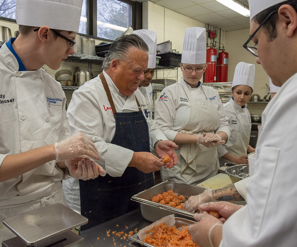 Chef Robin Rosenberg, vice president and chef de cuisine for Levy Restaurants, works with students to form the smoked-salmon lollipops, one of several hors d’oeuvres served during the pre-dinner reception in the Keystone Dining Room. From left are Ricky J. Frankhouser, of Jersey Shore; Erik L. Perry Jr., of Waldorf, Md.; Kiesha M. Sheffer, of Eldred; Alyssa L. Casler, of Barnesville; and Clayton T. Welch, of Benton.